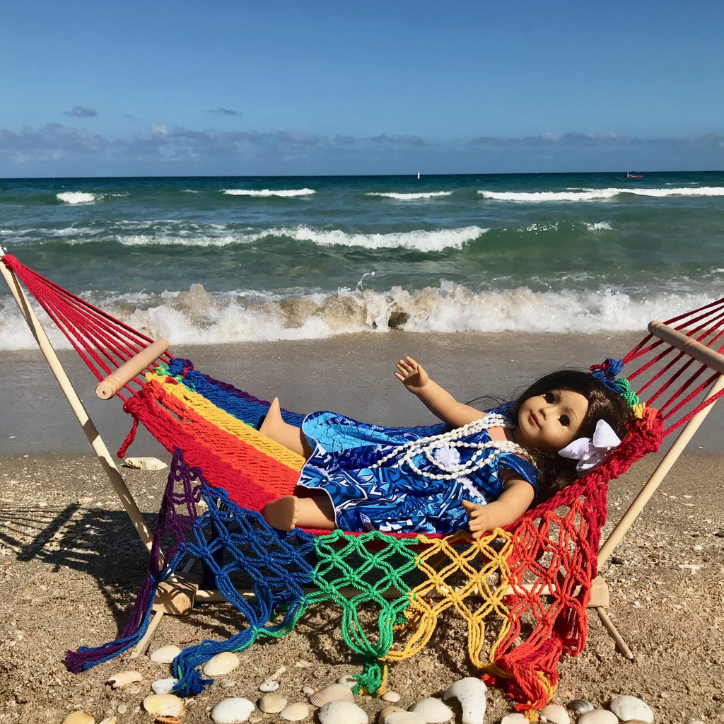 American Girl Doll at the beach lying on a rainbow colored hammock for 18 inch dolls | Aloha Products USA