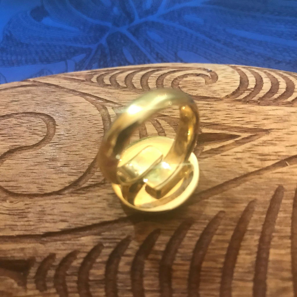 Back view of blue abalone ring showing adjustable size alchemia gold setting