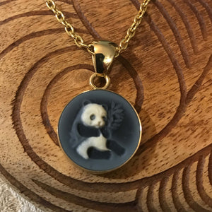 Close up view showing details of cameo panda pendant set on alchemia gold | Aloha Products USA