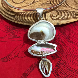 Back view of a multi-shell pendant showing the under side of the sea shells