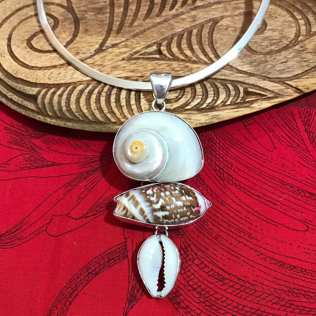 Island jewelry multi-shell pendant set in stirling silver using cinnerus, olive and cowry shells | Aloha Products USA