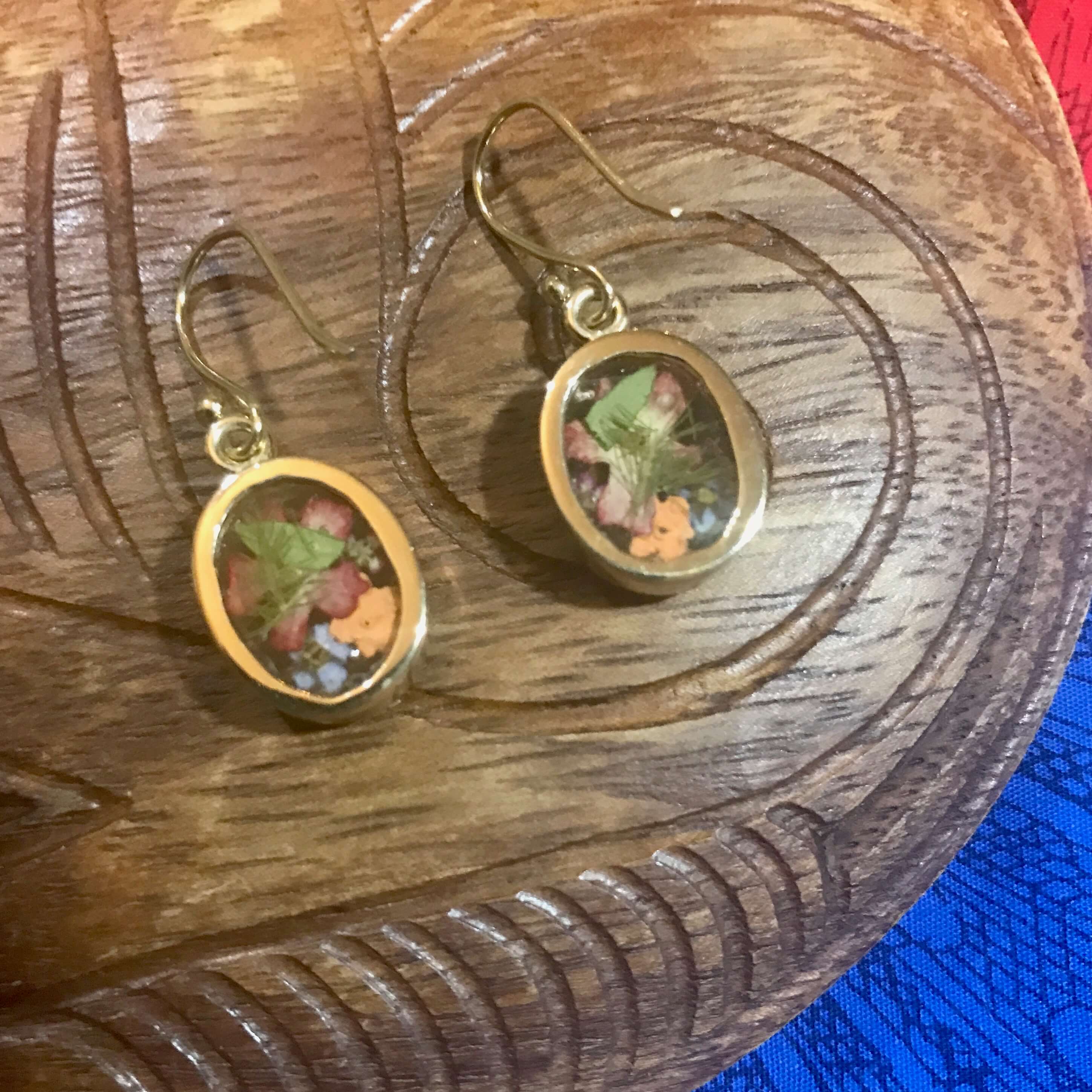 Back view of flower bouquet resin earrings set on alchemia gold