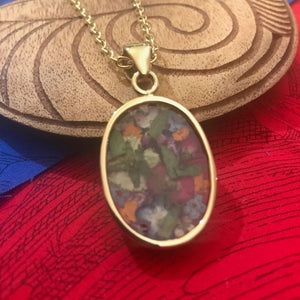 Back view of dried flower bouquet resin pendant necklace