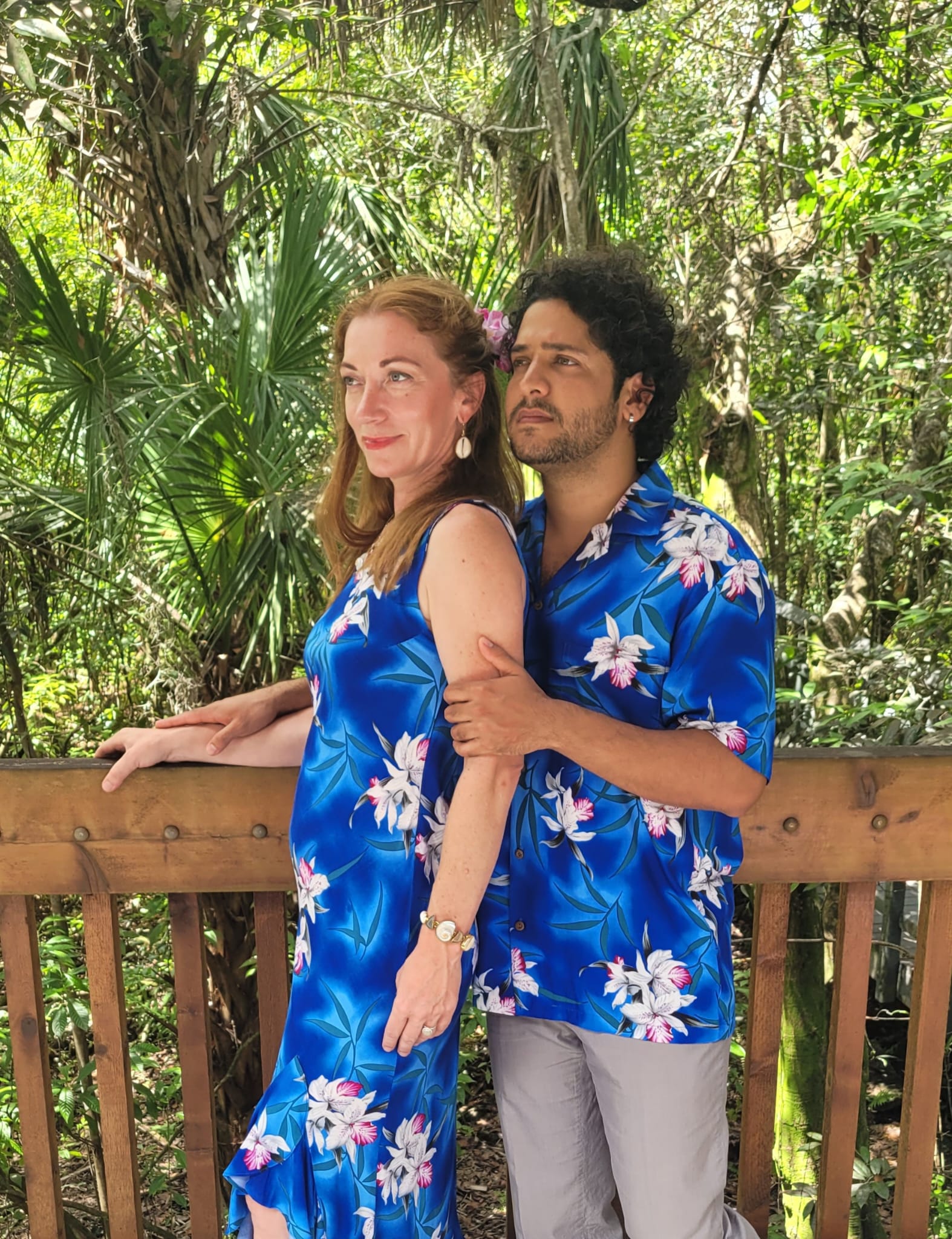 Cute Hawaiian couple with matching blue orchid dress and shirt for family outfit | Aloha Products USA