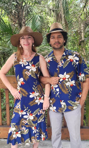 Cute Hawaiian couple wearing matching  outfits in navy blue orchid for family | Aloha Products USA