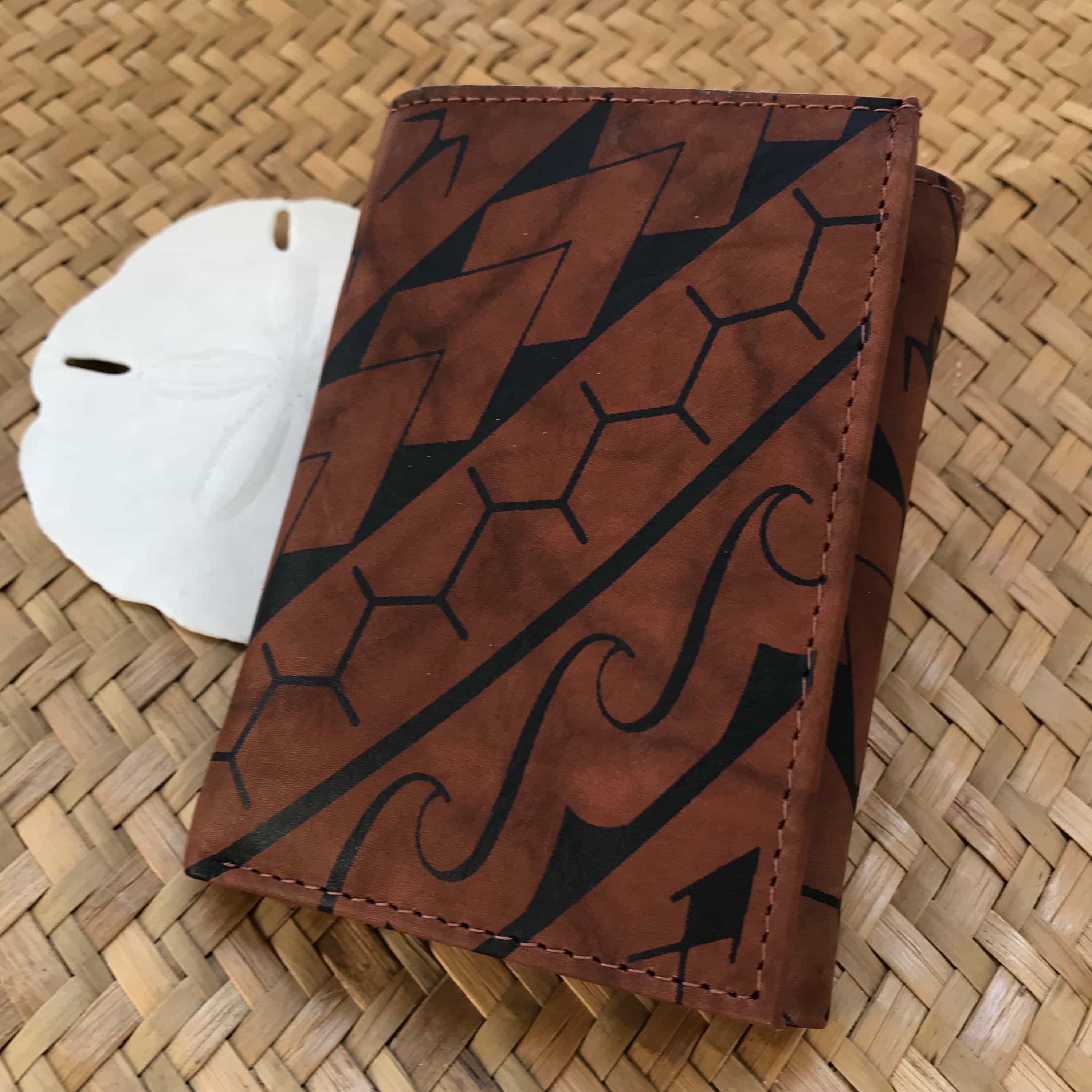 Hawaiian gift for men brown leather trifold wallet with tribal sun design | Aloha Products USA