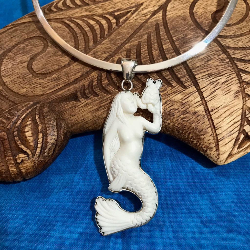 Island jewelry carved bone mermaid pendant necklace with a stirling silver setting | Aloha Products USA