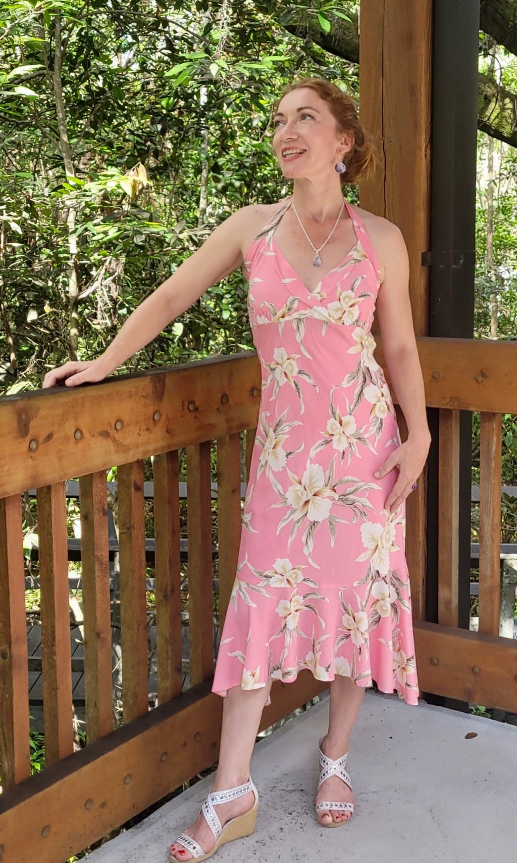 Woman wearing a pink orchid halter dress for matching Hawaiian couple outfit | Aloha Products USA