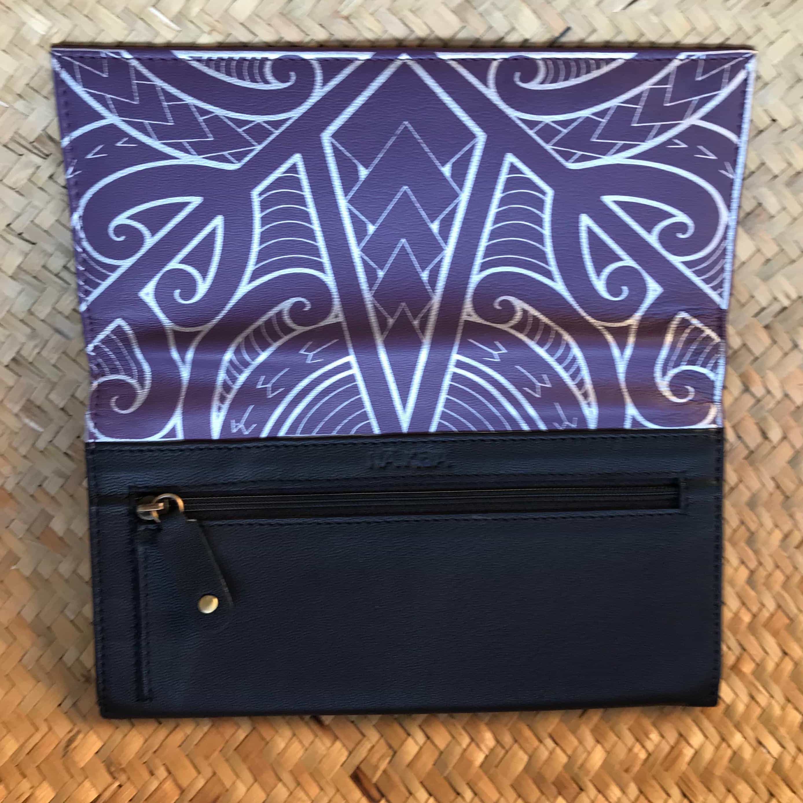 Open front view of a purple leather clutch wallet