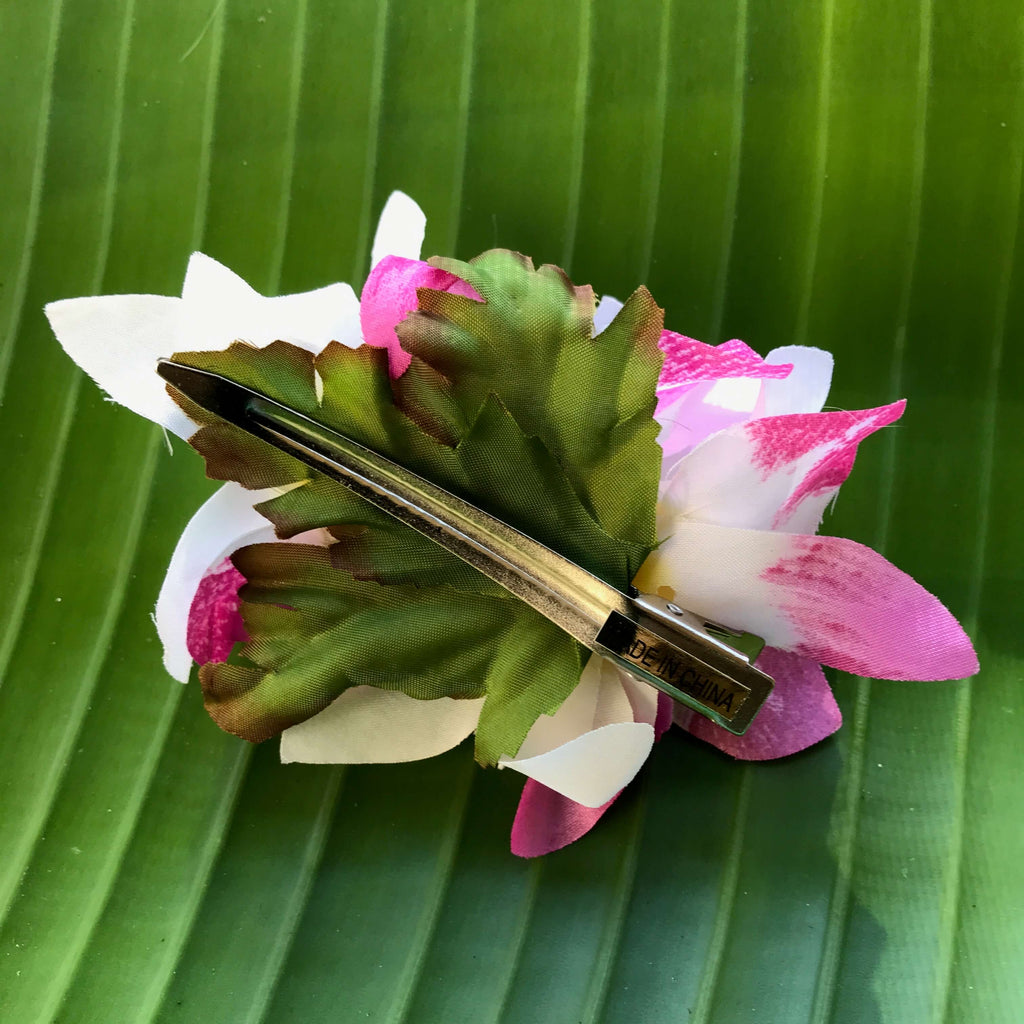 Back view of a purple and white orchid hair clip