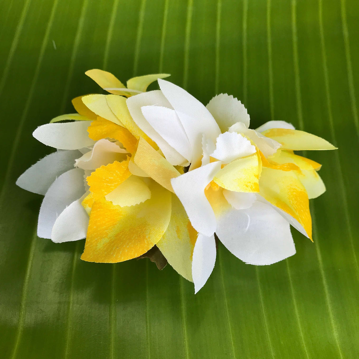 Hawaiian silk flower hair clip with white and yellow orchids | Aloha Products USA