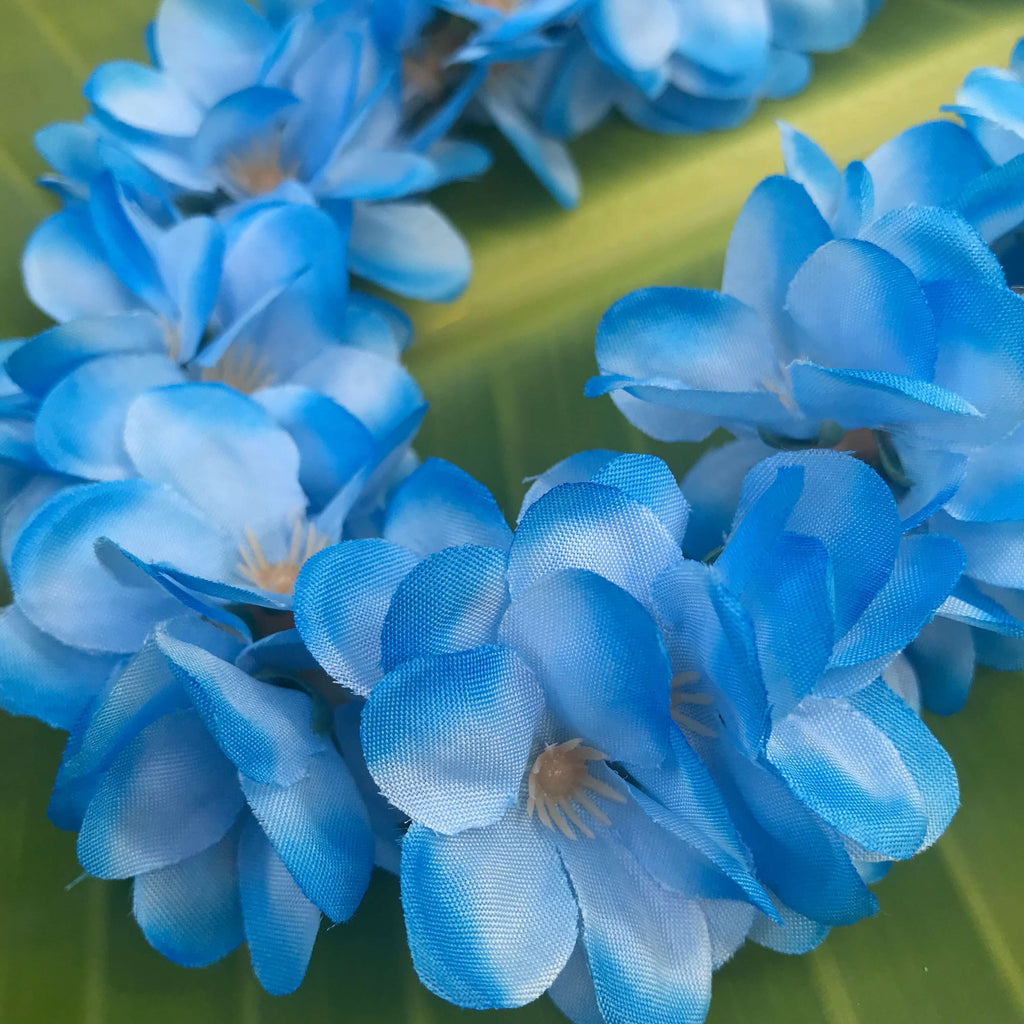 Close up view of mini blue silk plumeria flowers used for Hawaiian head lei