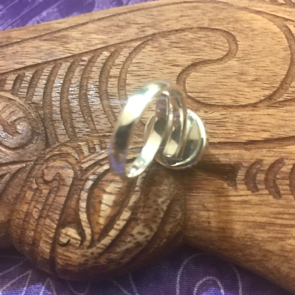 Back view of moonstone ring showing adjustable size setting on stirling silver