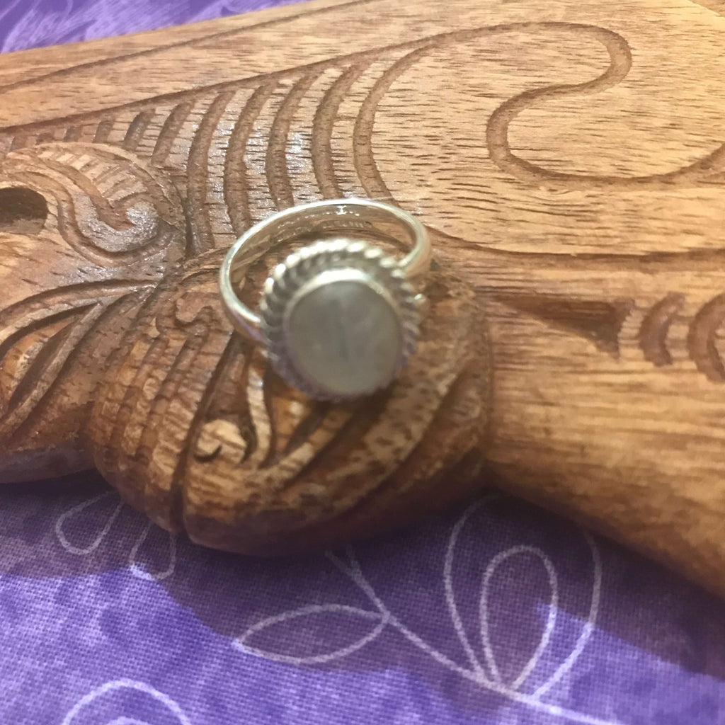 Flat front side view of stirling silver moonstone ring