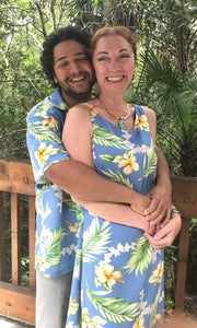 Matching Hawaiian couple wearing blue tuberose shirt and dress for family outfit | Aloha Products USA