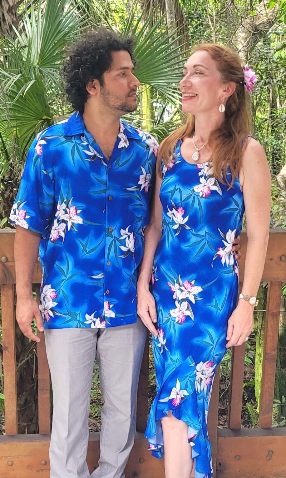 Couple wearing matching Hawaiian shirt and dress in blue orchid for family outfit | Aloha Products USA