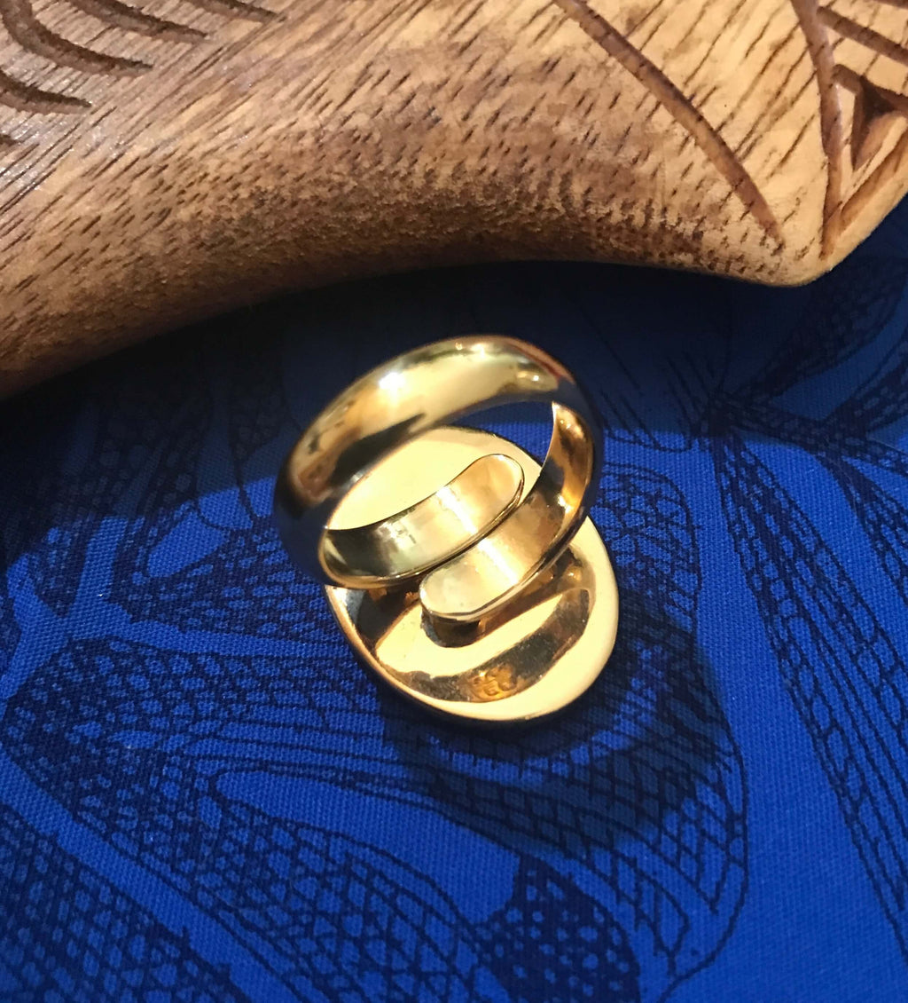 Back view of natural abalone ring showing adjustable alchemia gold setting