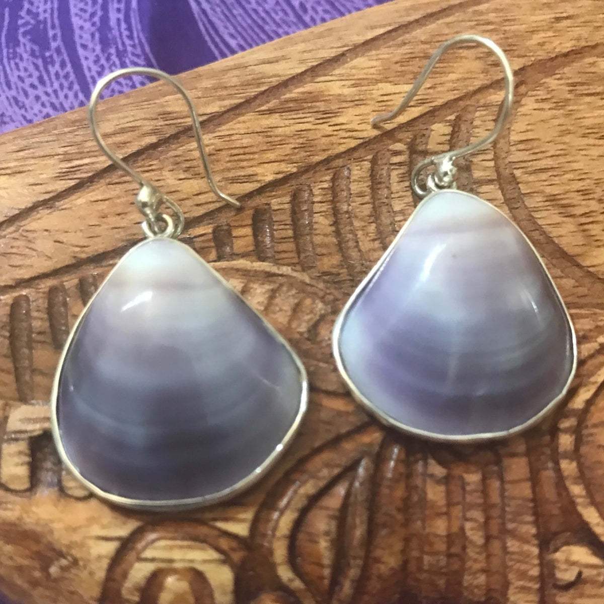 Close up view of purple clam shell earrings set on stirling silver | Aloha Products USA