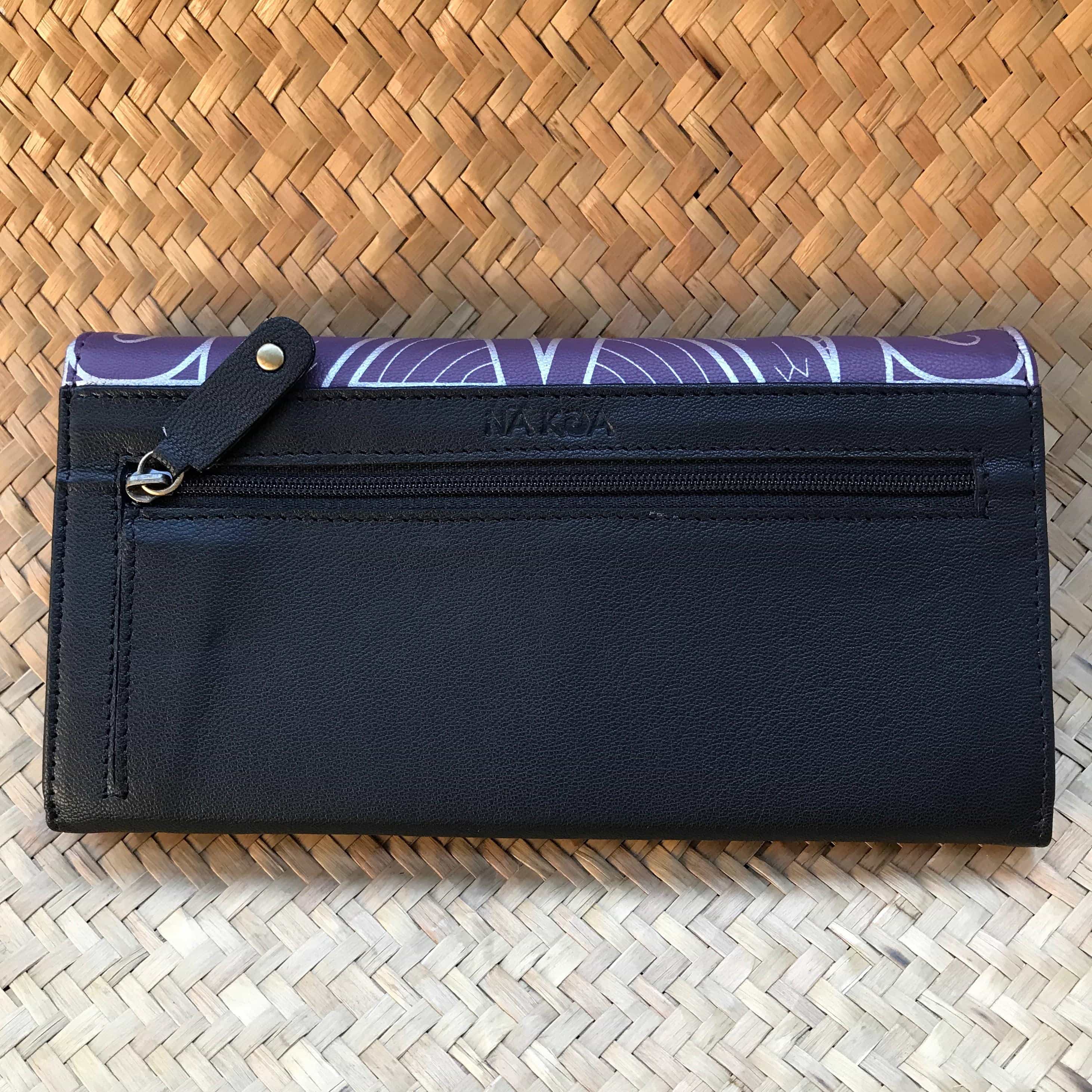 Back view of a purple leather clutch wallet