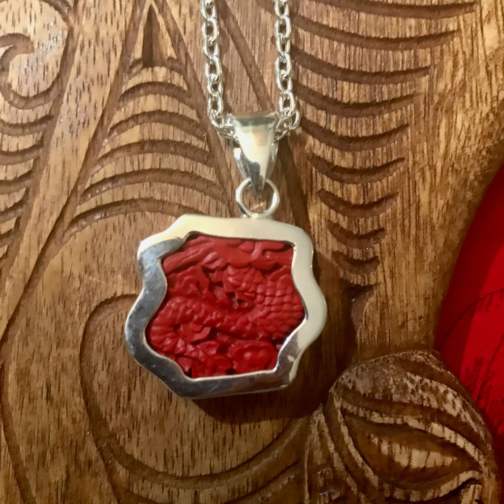 Back view of red cinnibar dragon pendant set in stirling silver