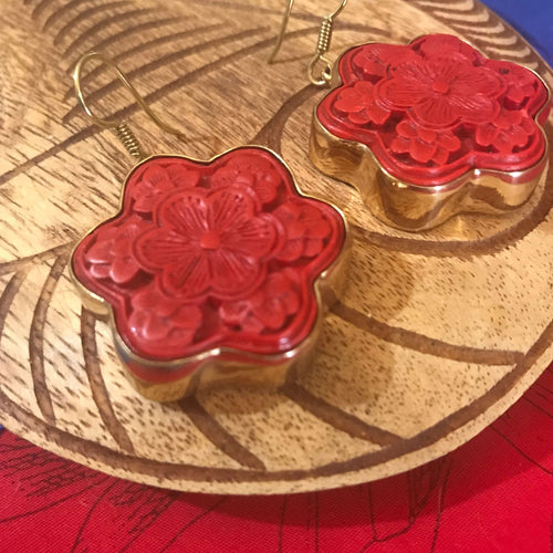 Close up view showing carved details of red cinnibar earrings | Aloha Products USA