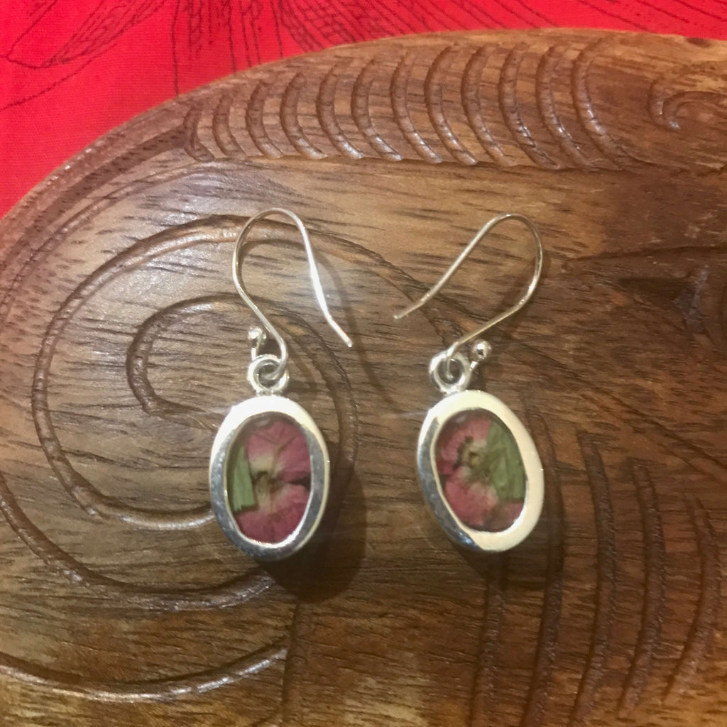 Back view of dried red flower resin earrings set in stirling silver