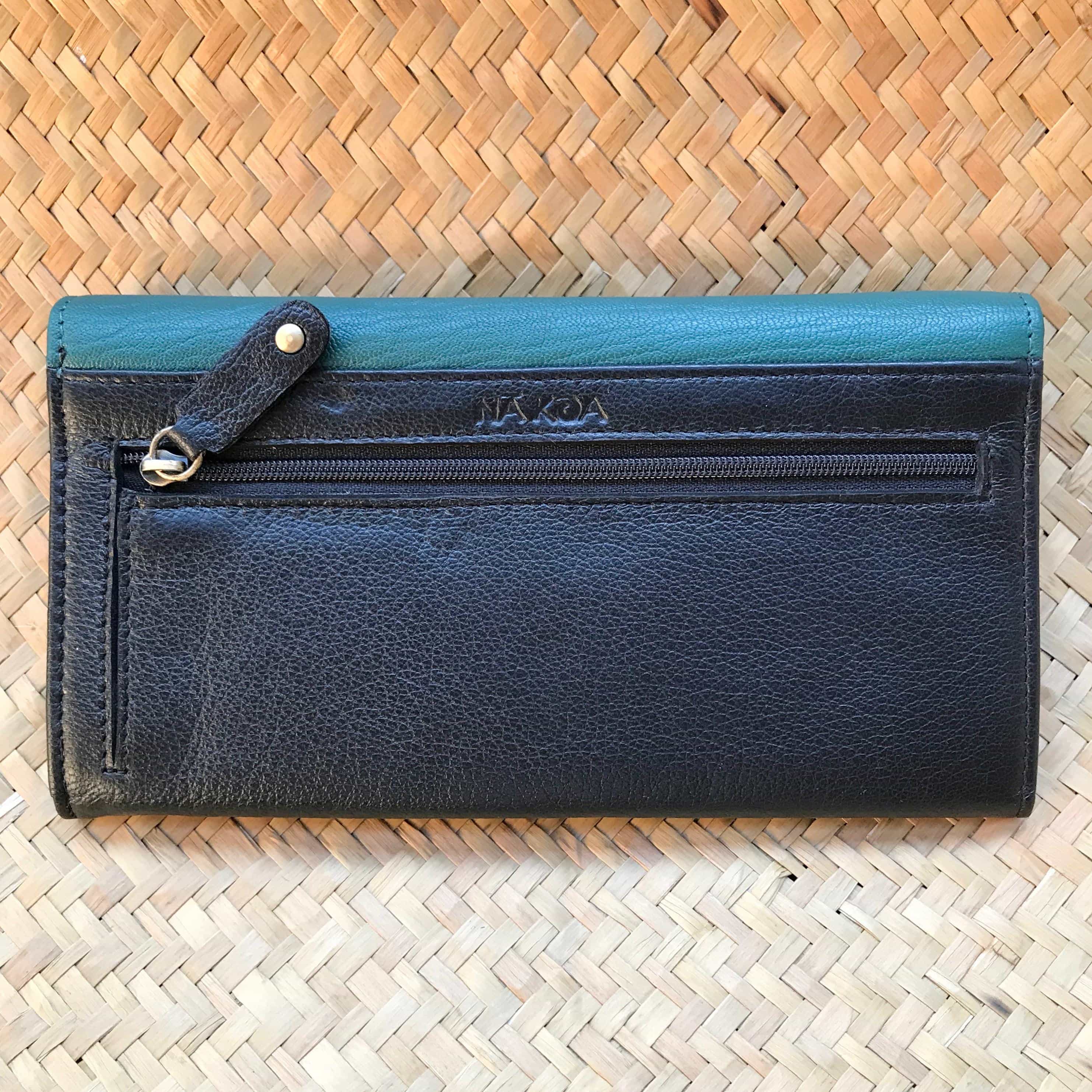 Back view of a green leather clutch wallet for women