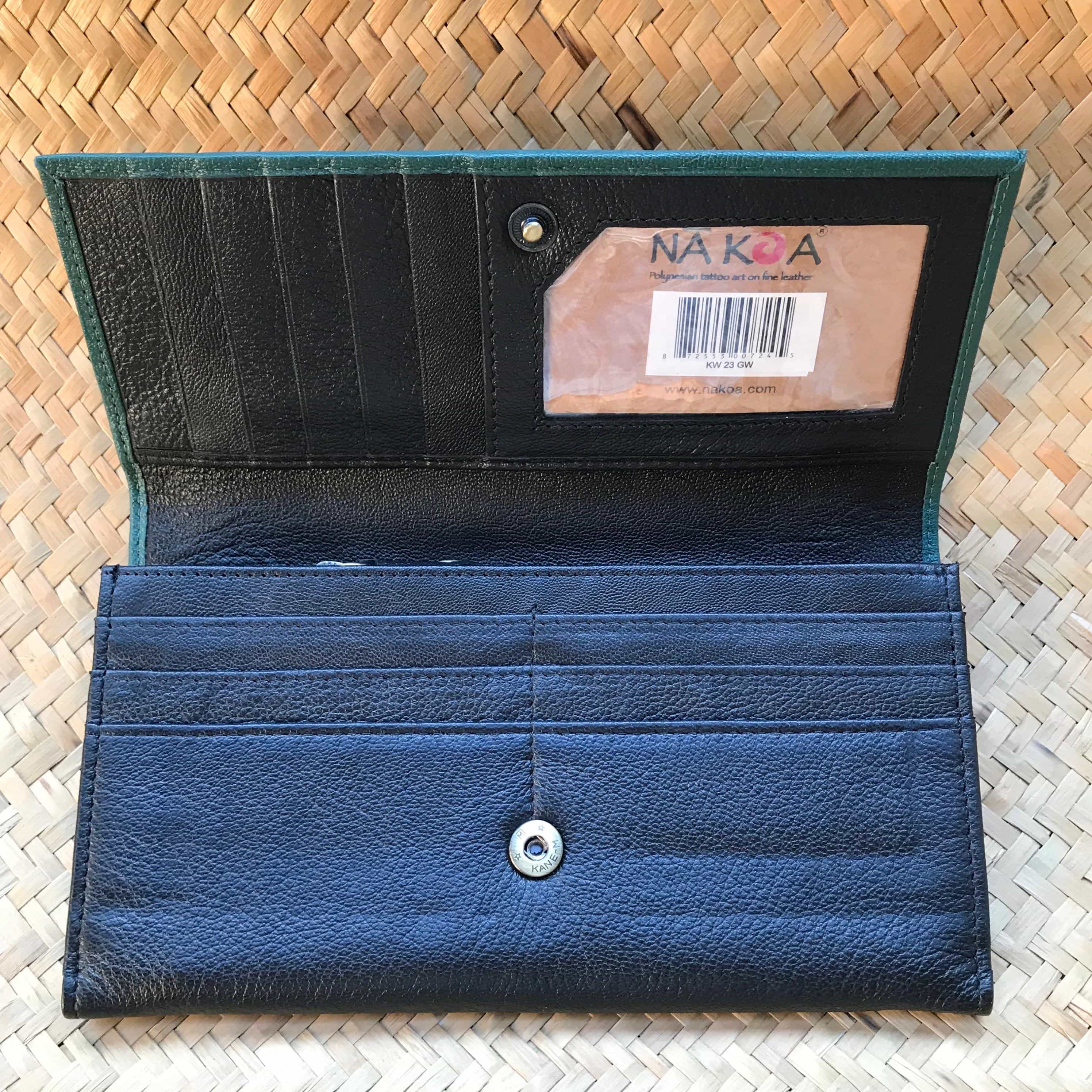 Inside open view of a green leather Hawaiian clutch wallet for women