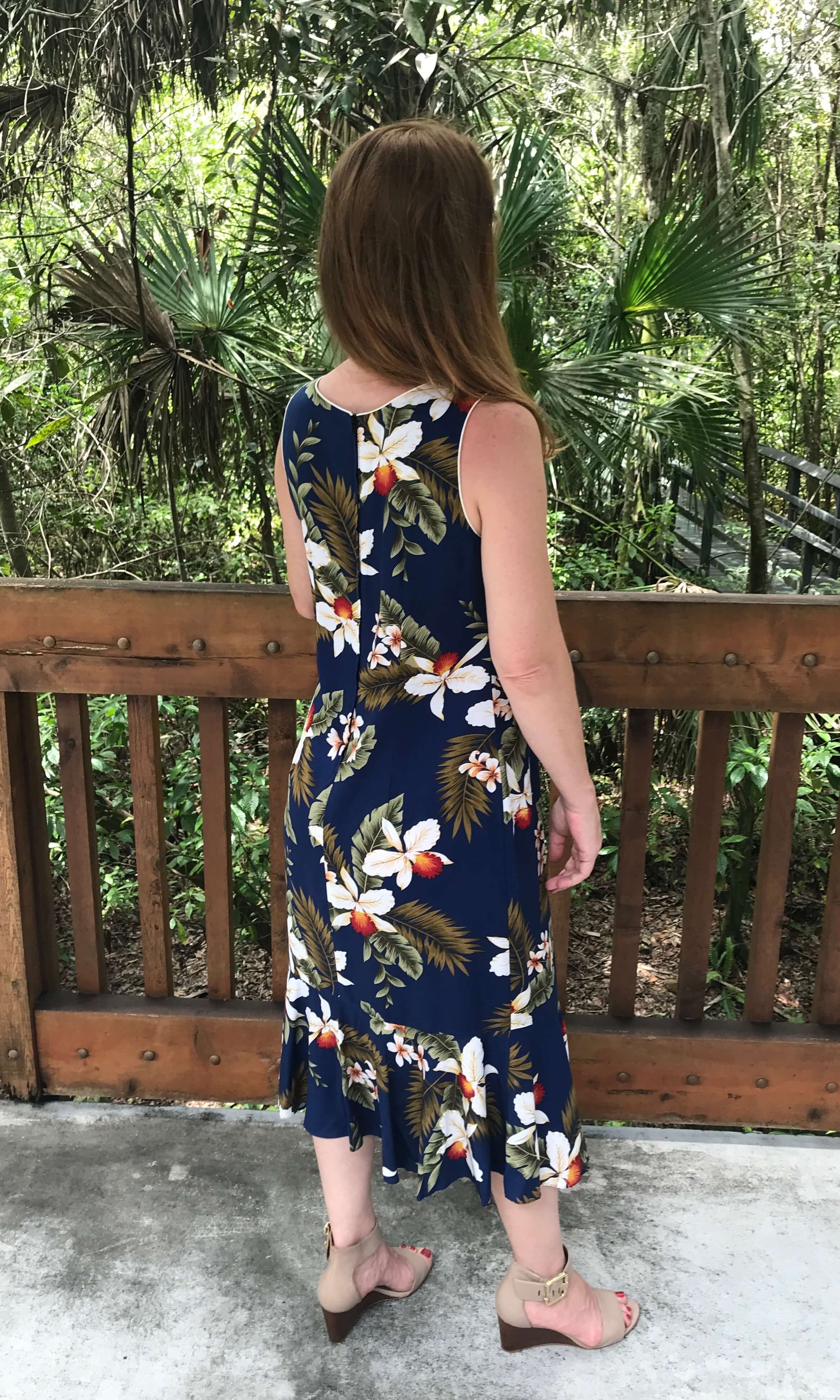 Back view of a blue Hawaiian mid length sleeveless dress with zipper back | Aloha Products USA